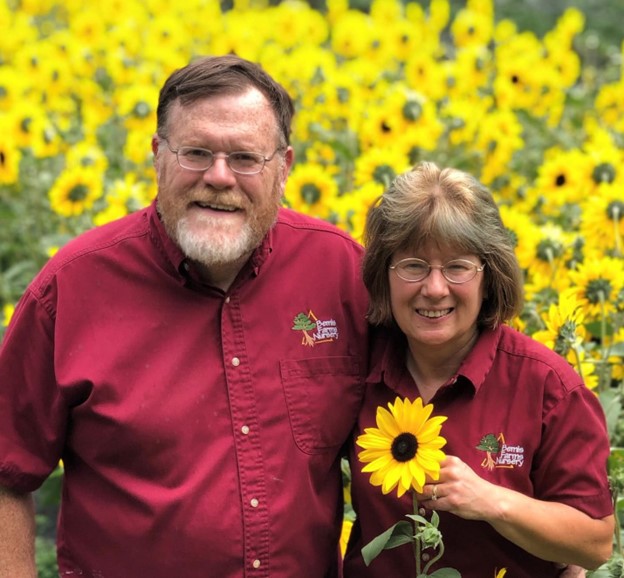 Photo of Ed and Tina Bemis in sunflower field