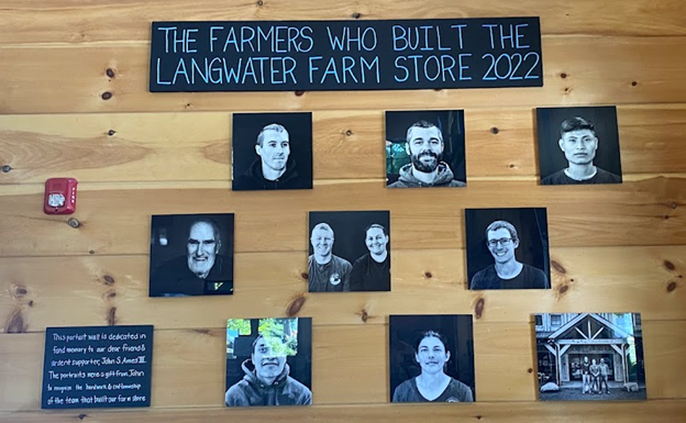 A wall of photos of the people who built the Langwater Farm store in 2022.